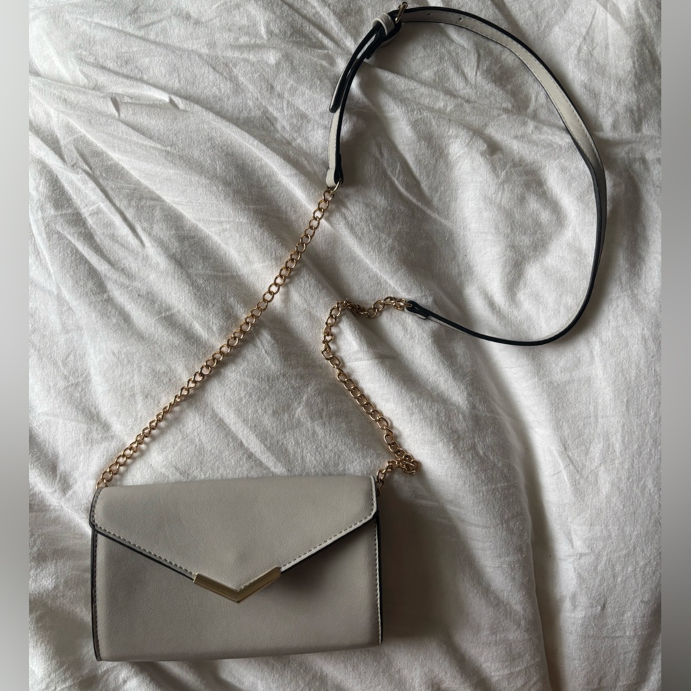Light blue cross body snap closure purse
